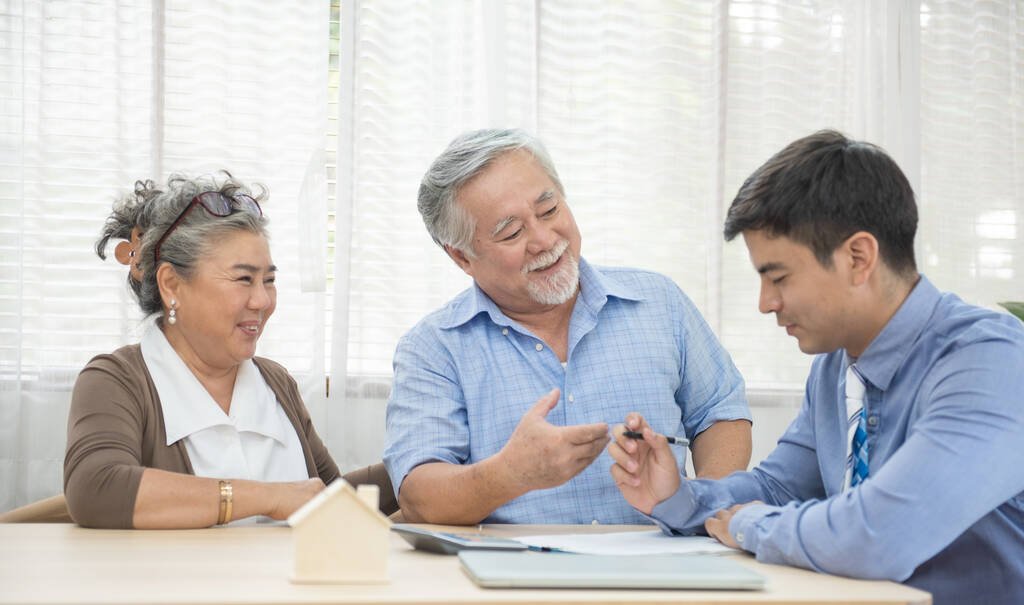 old couple with mortgage broker