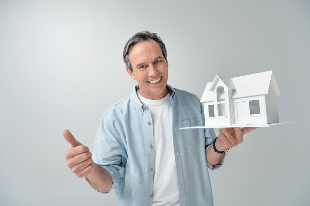 man with house model